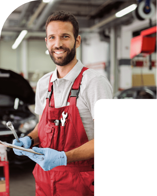 Mechanic in red vest smiling