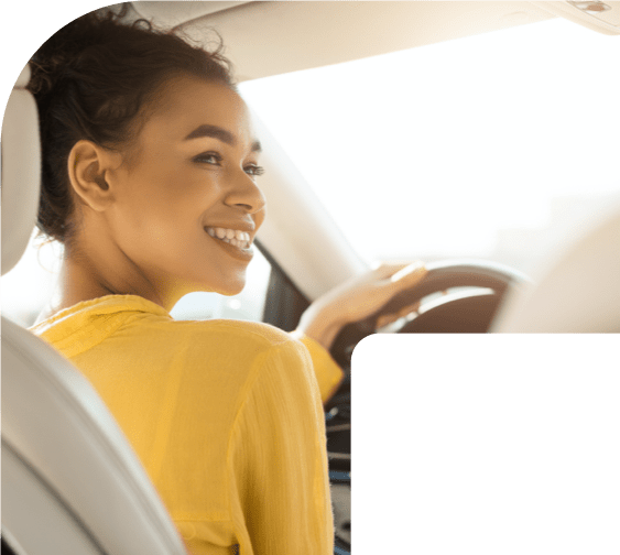 Woman in Driver's Seat Smiling