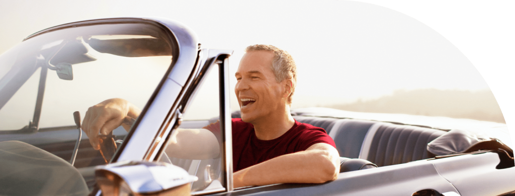 Smiling Man Driving Convertible
